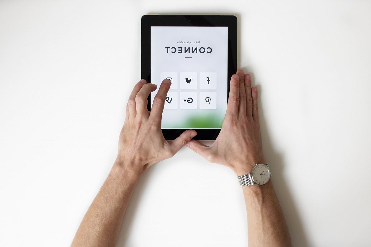 person using black iPad