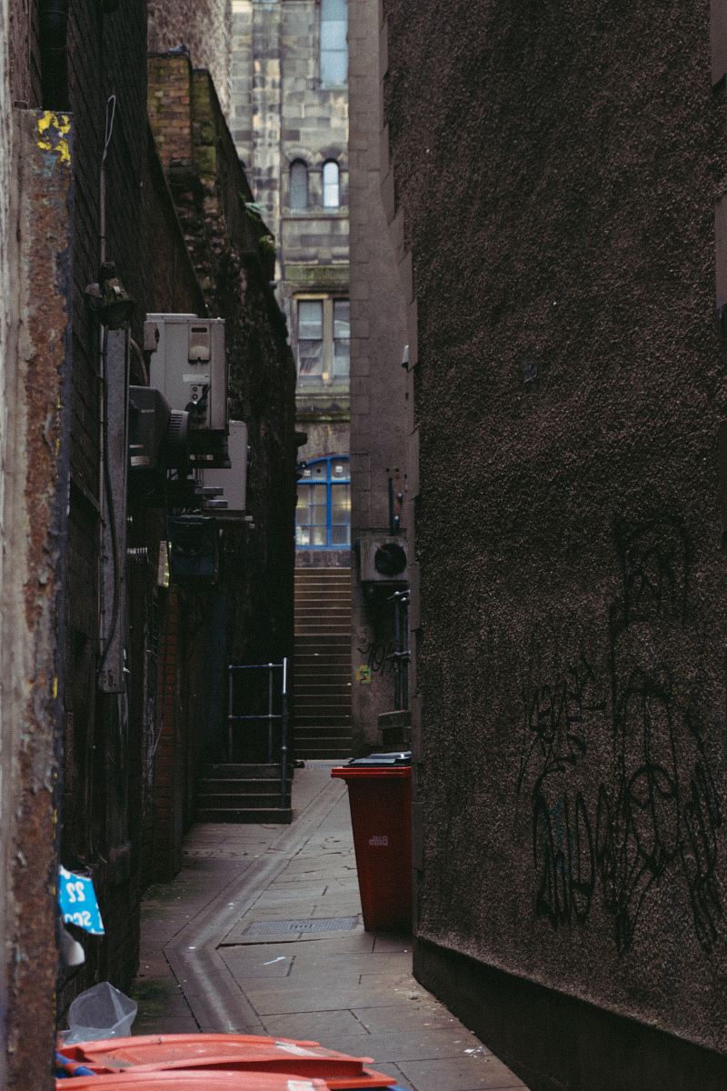 photo of red plastic trash bin