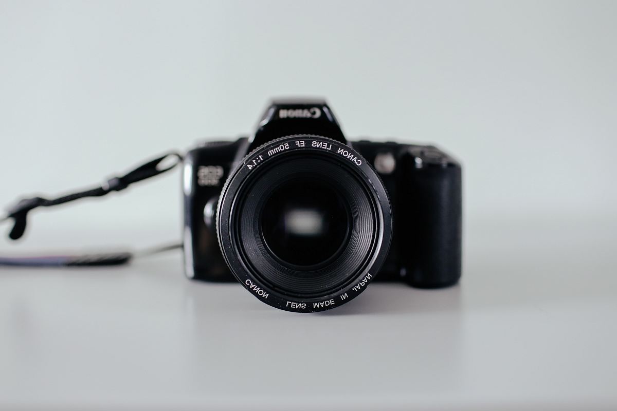 selective focus photo of black Canon DSLR camera