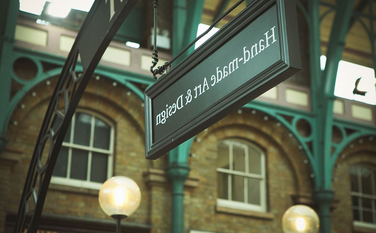 selective focus photo of Hand-made Art & Design signage