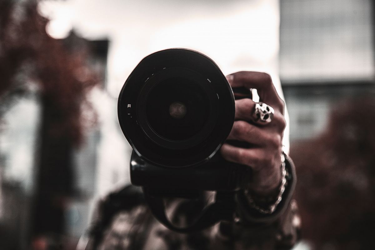 Selective Focus Photo Of Person Holding Camera Image Free Photo