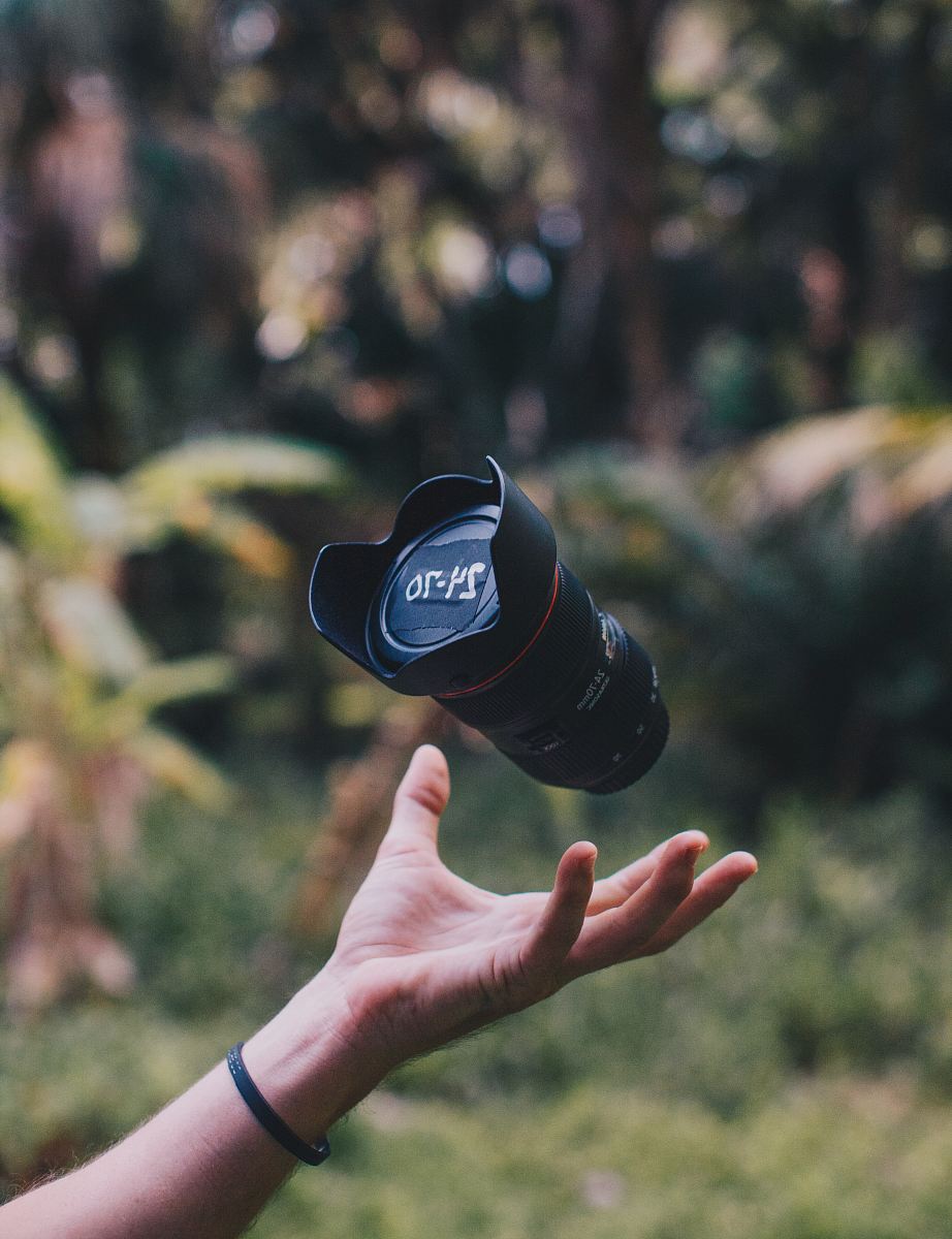 shallow focus photo of black DSLR camera lens