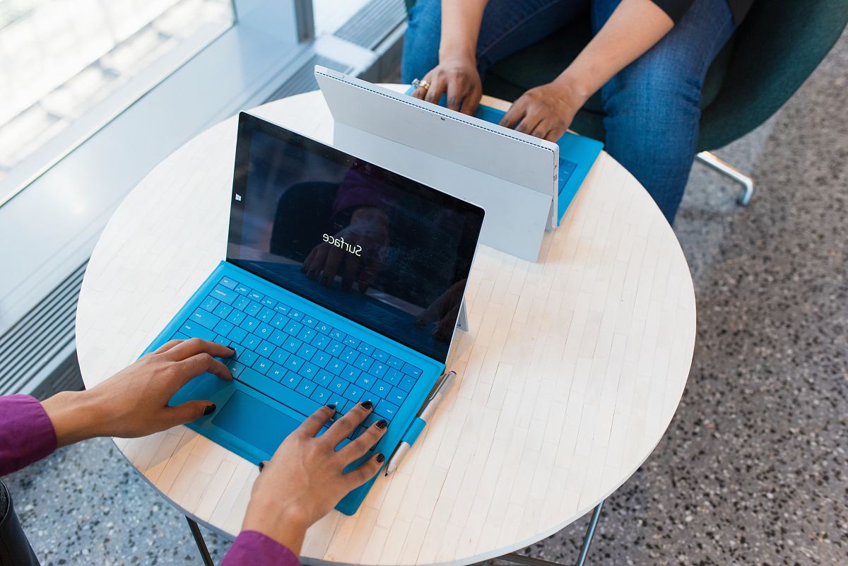 two person using Microsoft Surface