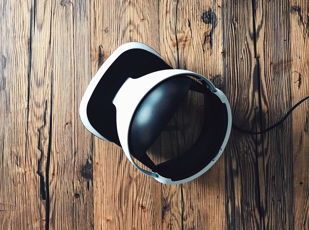 white and black Bluetooth headphones
