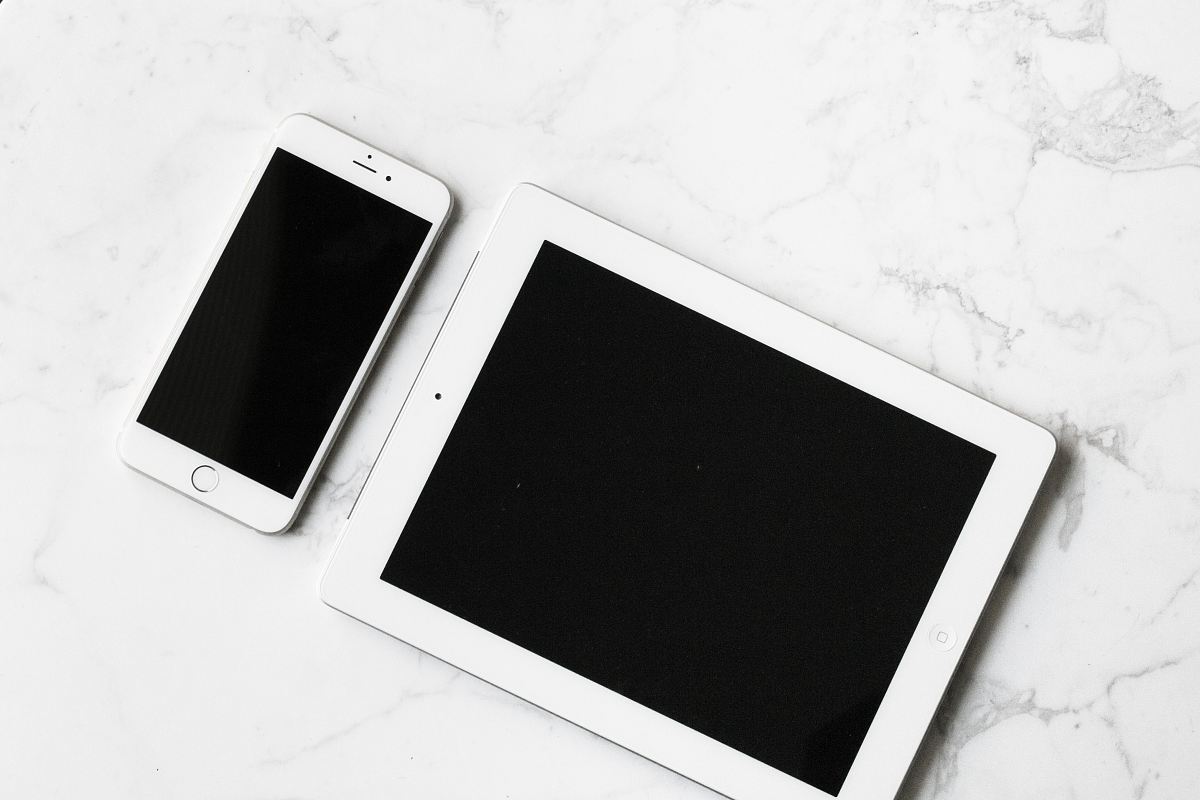 white iPad and silver iPhone 6