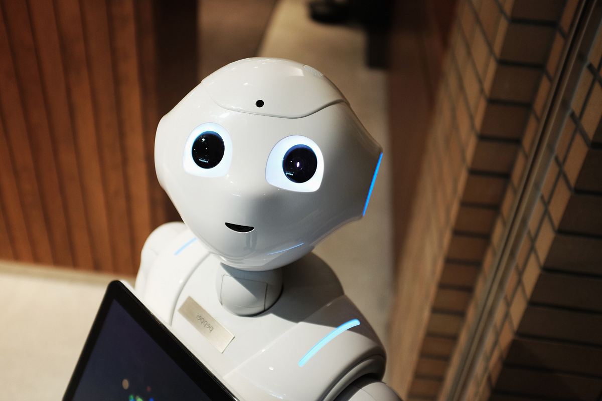 white robot near brown wall