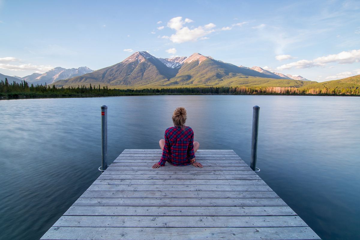 Woman Sitting On Dock Bridge Near Lake During Daytime Image Free Photo