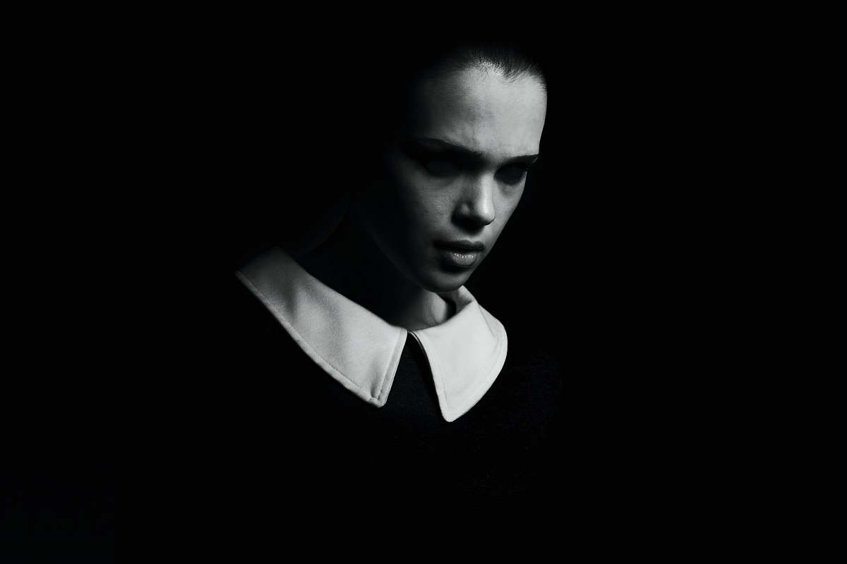 human woman in black v neck shirt person