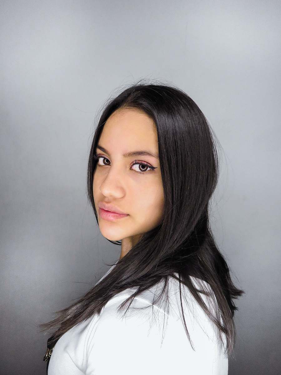 face woman in white crew neck shirt hair