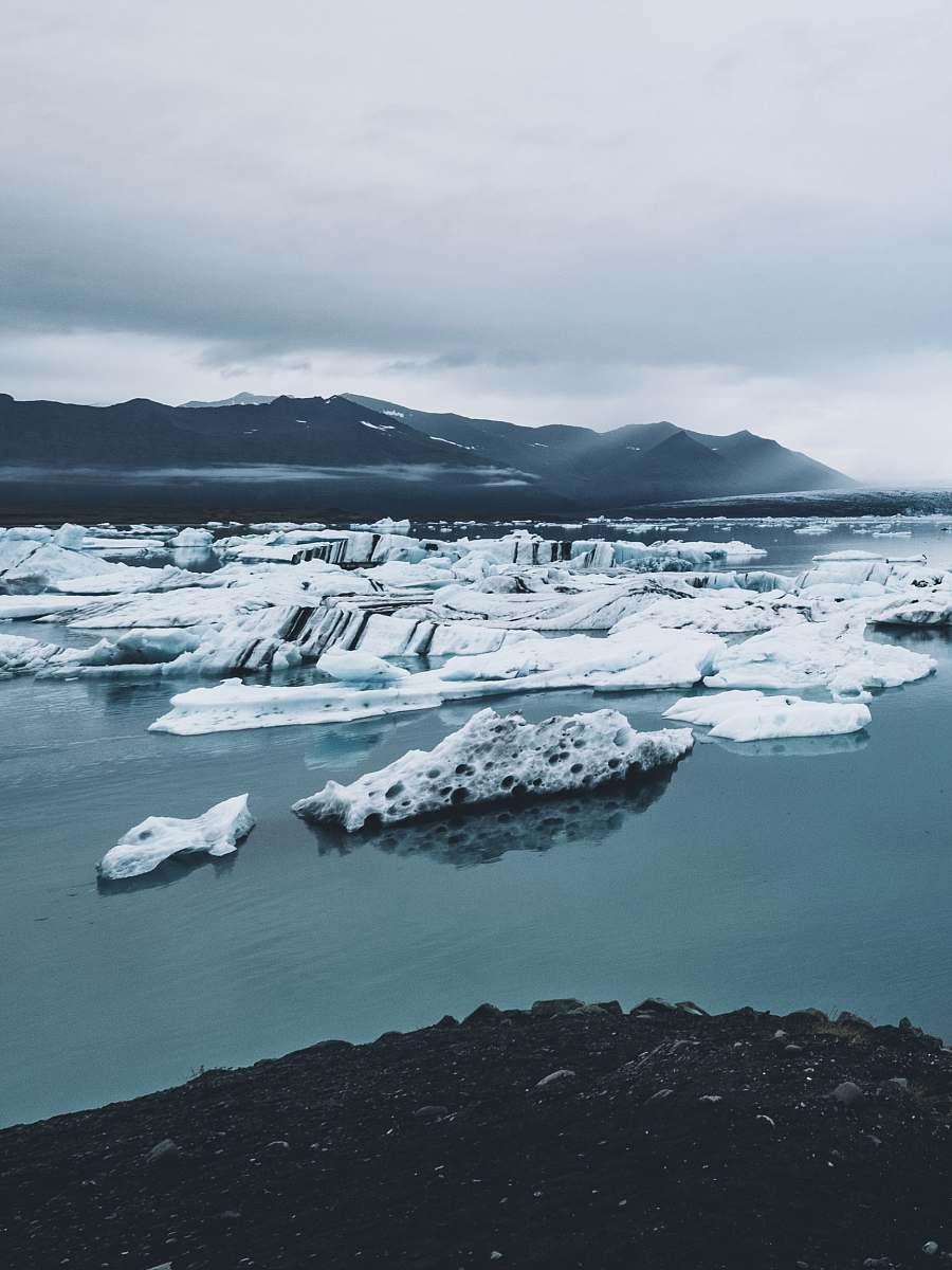 ice icebergs on body of water glacier