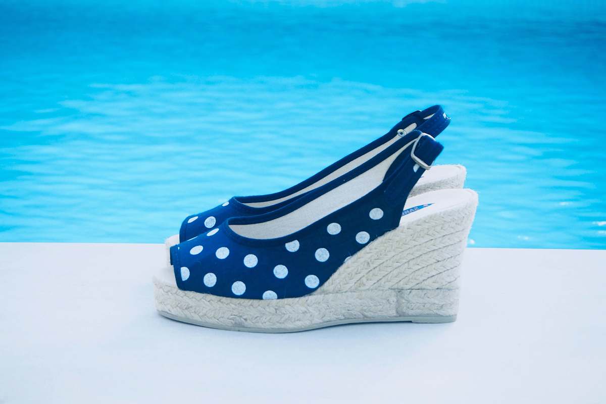 apparel pair of blue and white polka dot wedge heeled sandals shoe