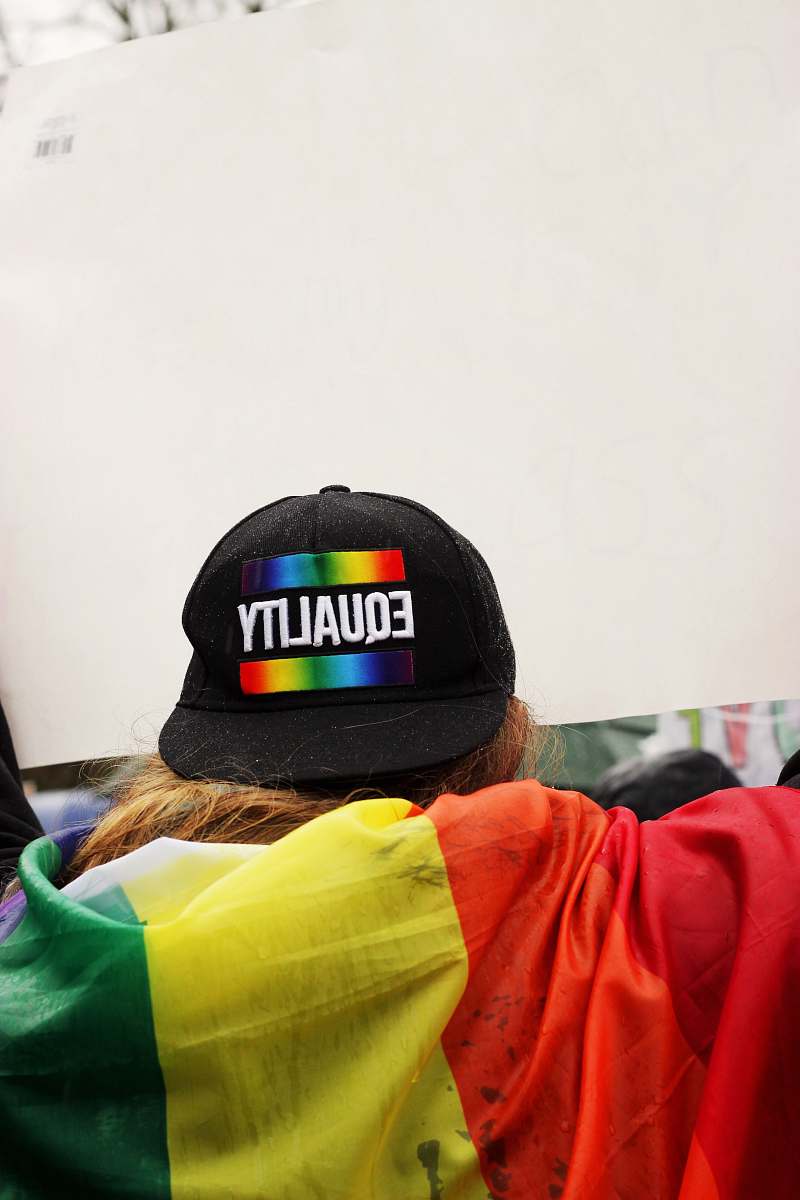  person wearing black Equality printed cap 