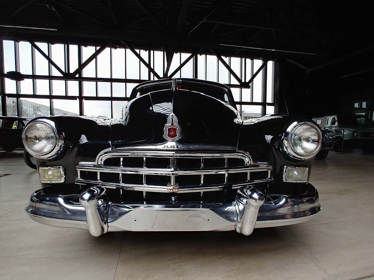 vintage black car parked at the garage 