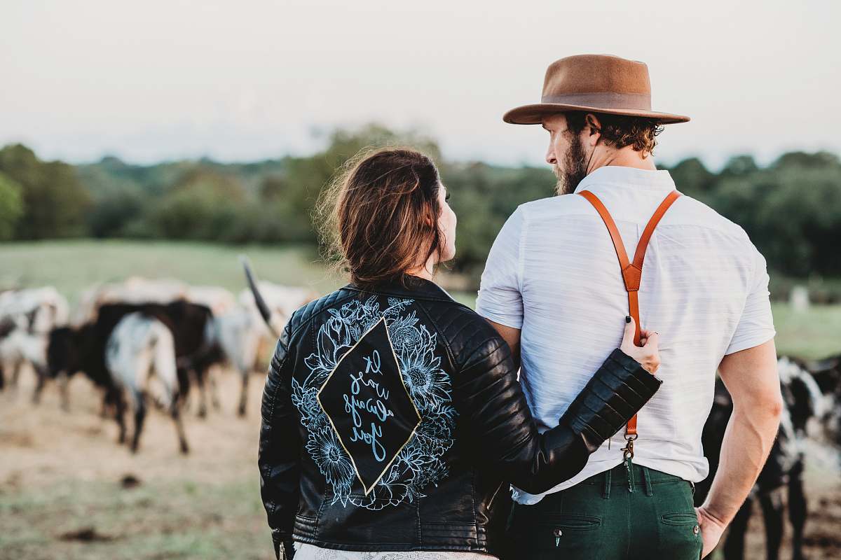 clothing man and woman on green field with cattles person