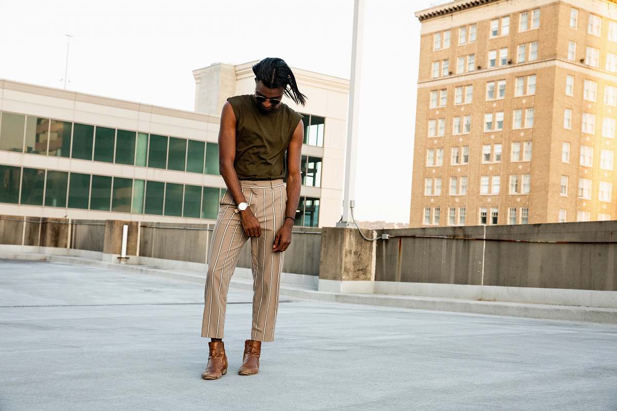 clothing standing man wearing brown sleeveless shirt human