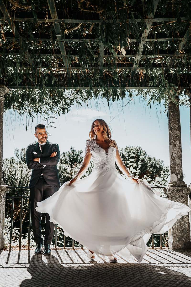 wedding woman wearing white dress beside man wearing formal suit under wooden roof during daytime clothing
