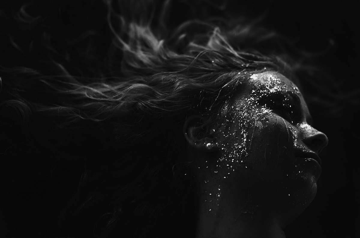 Experience the captivating moment of a woman as water splashes onto her face, framed by her flowing hair dancing in the wind. This stunning scene, set against the natural beauty of Bozeman, Montana, offers a vibrant representation of joy and freedom, perfect for projects focused on outdoor adventures, sports, lifestyle, or beauty. Ideal for advertisements, social media campaigns, or editorial content, this image captures the essence of spontaneity and nature's refreshing embrace.