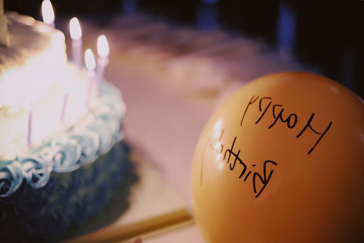 food yellow balloon near cake birthday cake