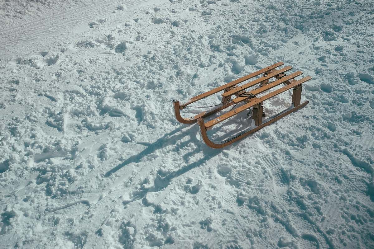 winter brown sled on snow during daytime sleigh