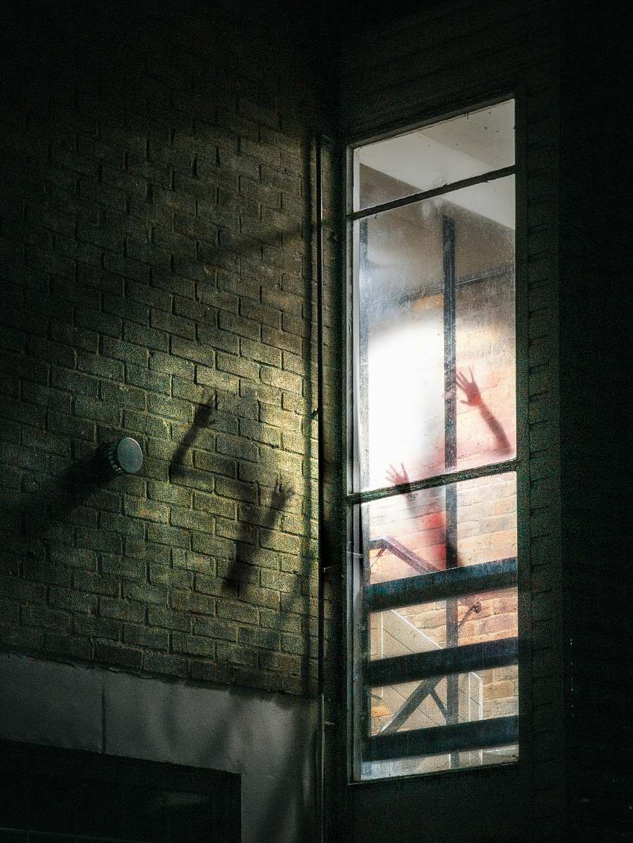 window gray glass frame brick