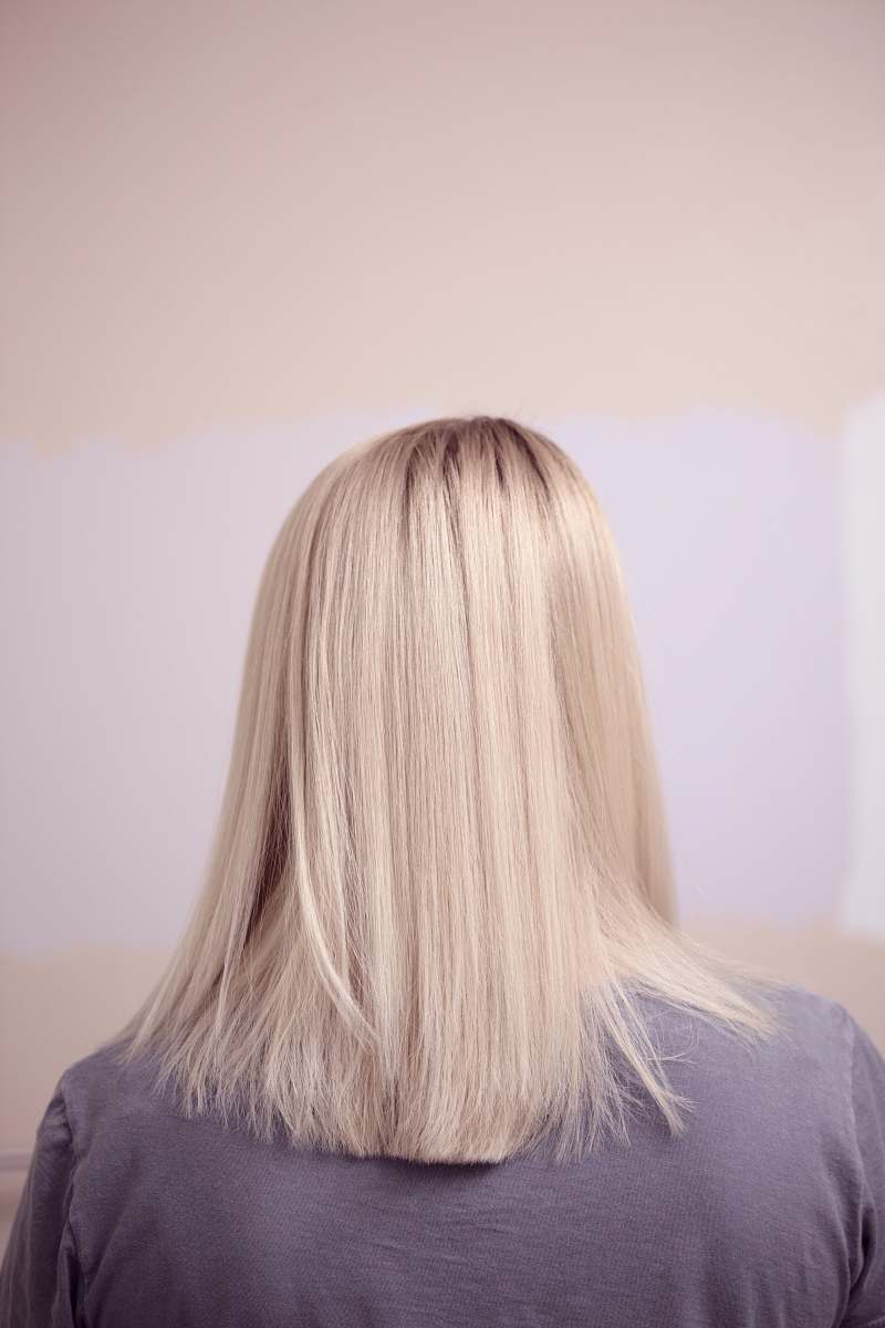 blonde woman wearing gray top woman