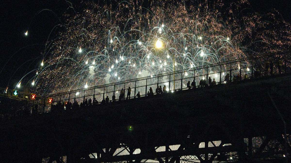 montreal photo of firework displays during night time bridge