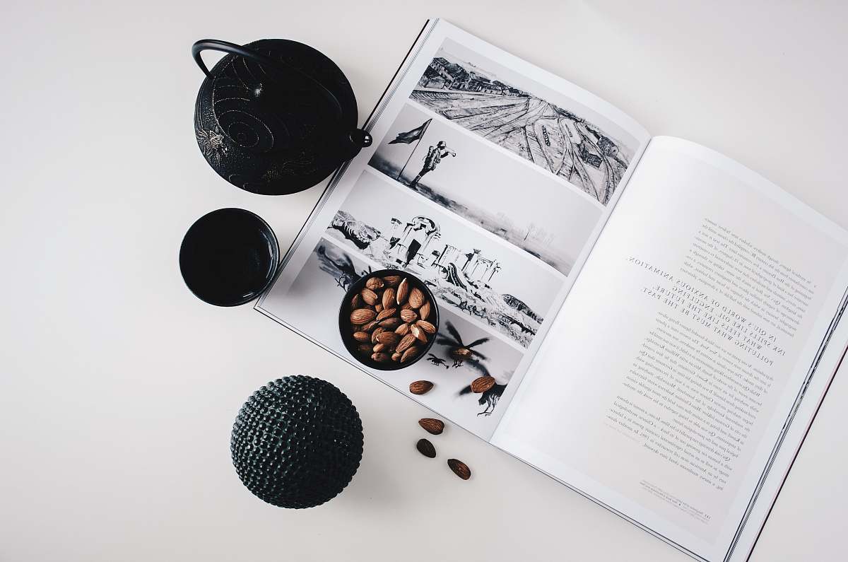 tea selective color photo of teapot and teacup on book lifestyle