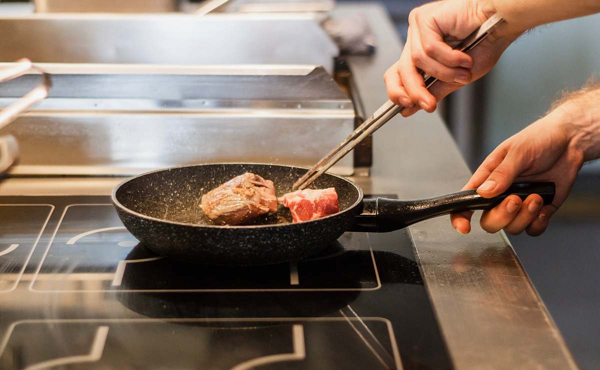 person unknown person frying meat human