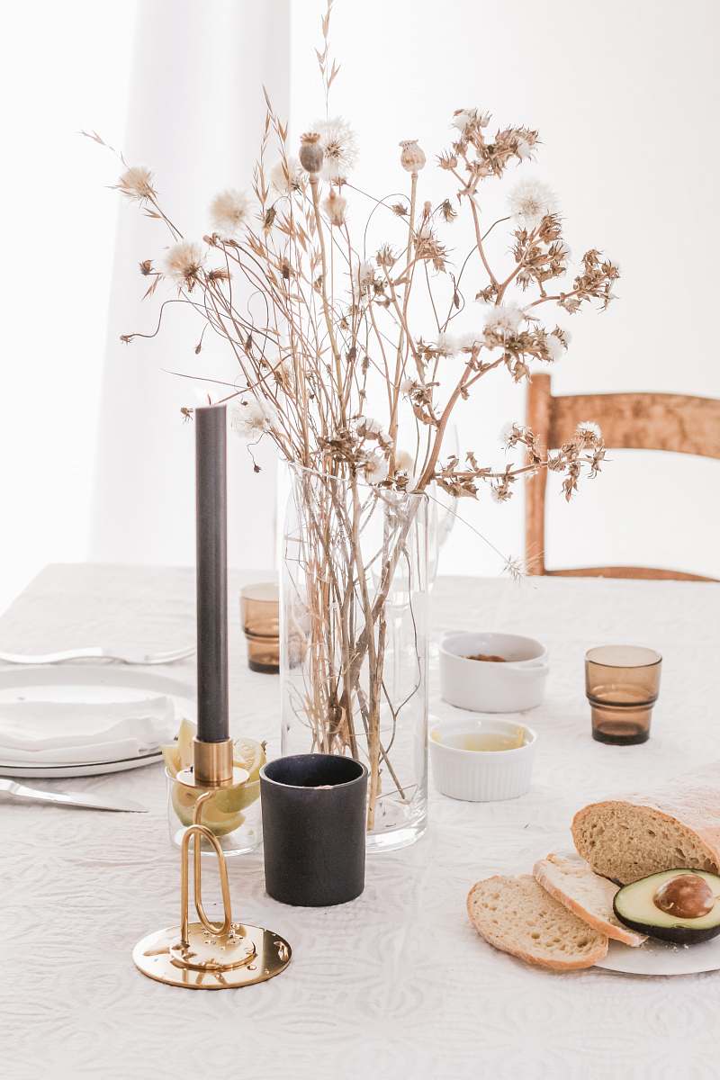 table bread and flower placed on table tabletop