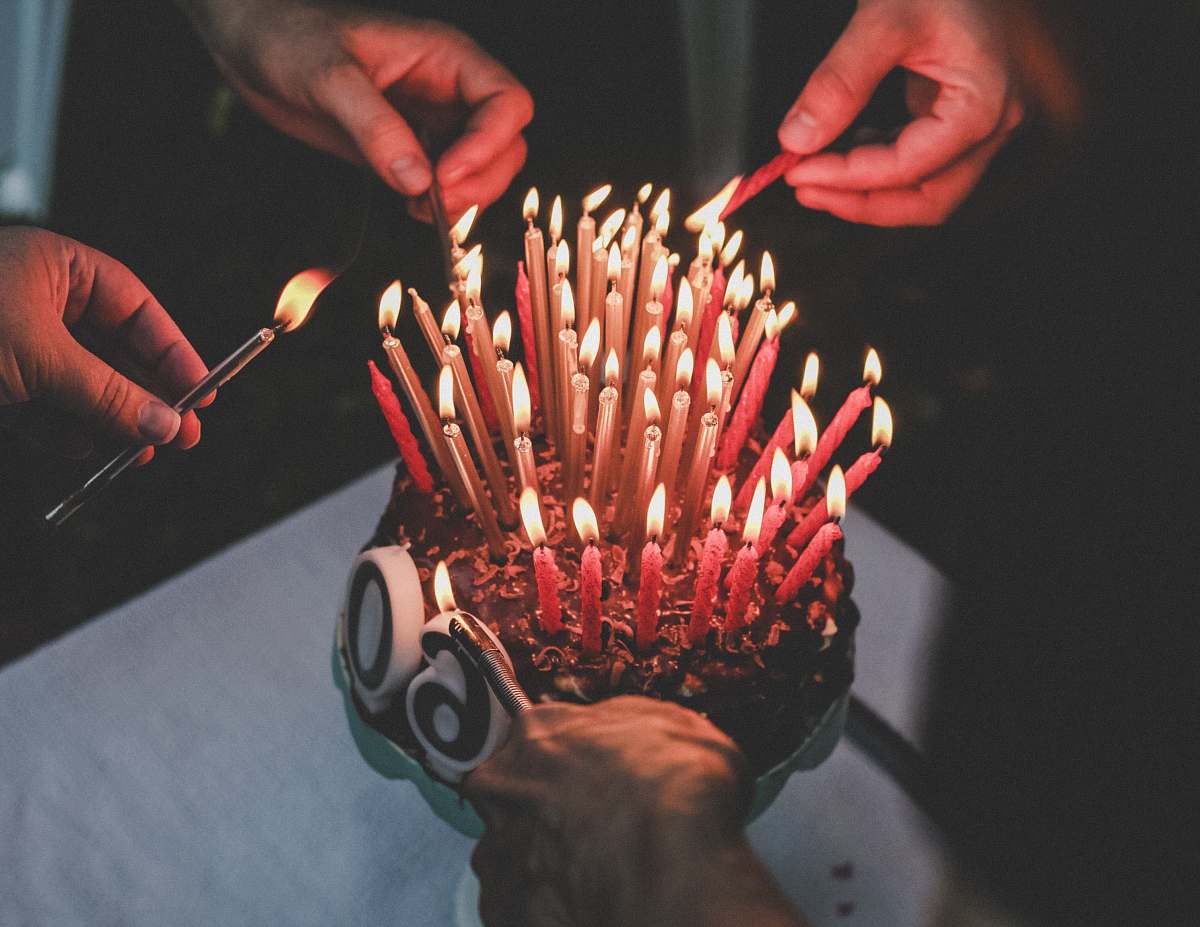 person cake red candle lot cake