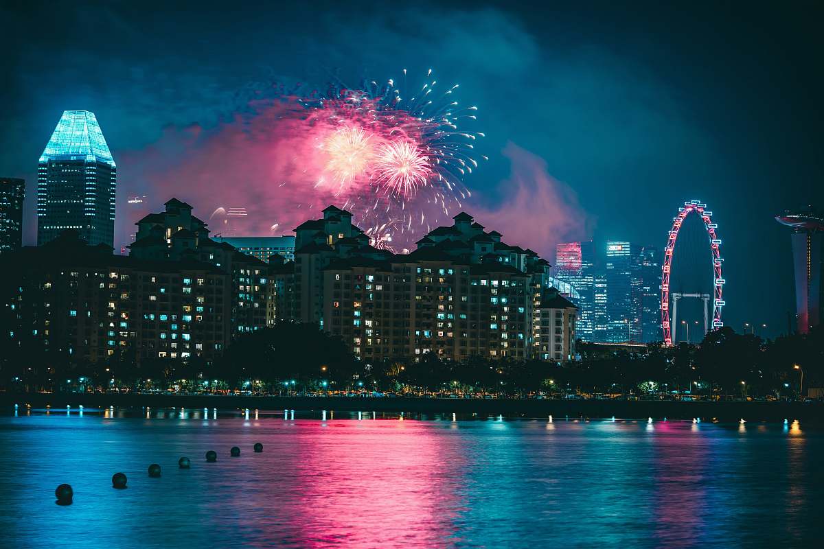 fireworks fireworks above high-rise buildings at nighttime outdoors