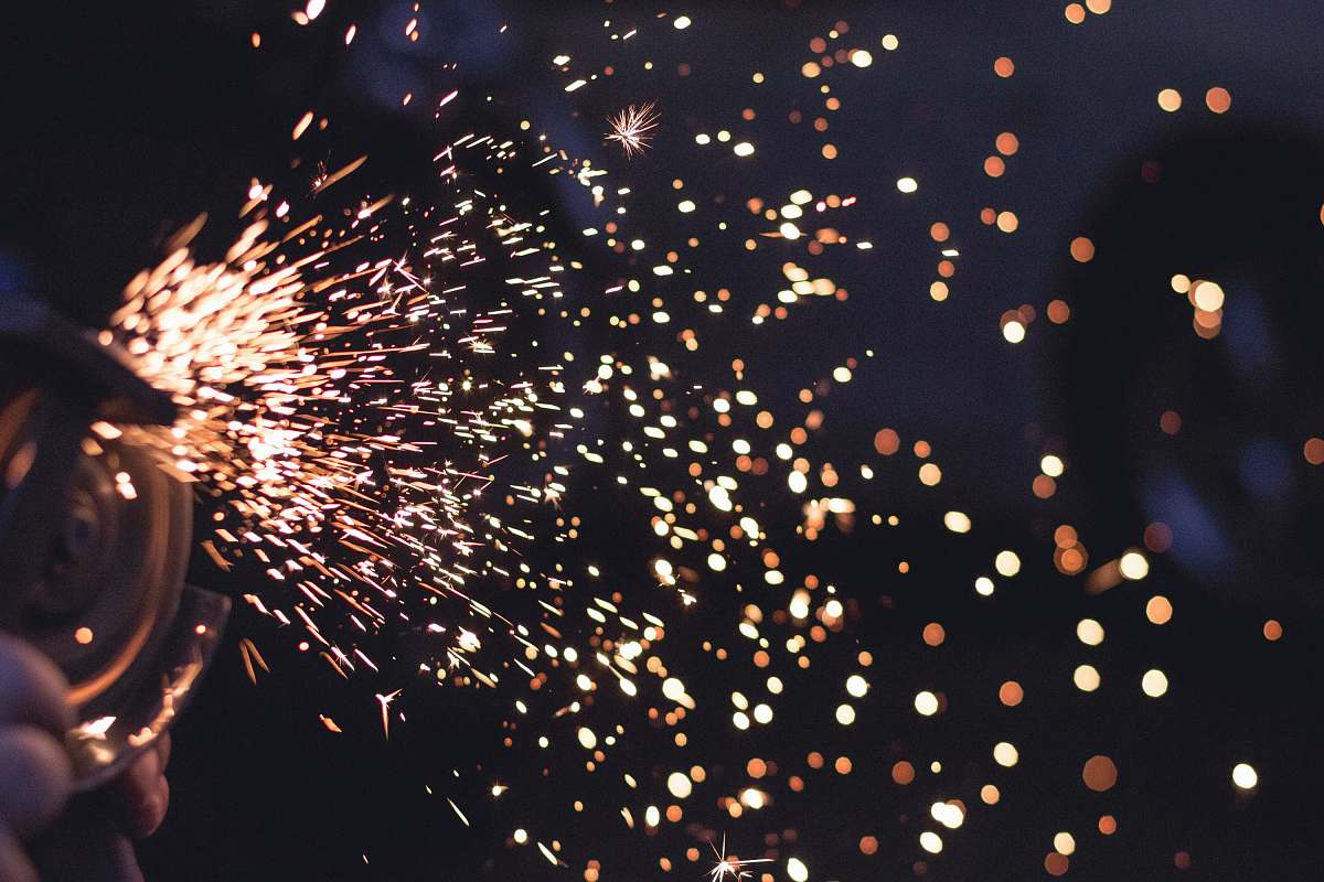fireworks time-lapse photography of person grinding during nighttime spark