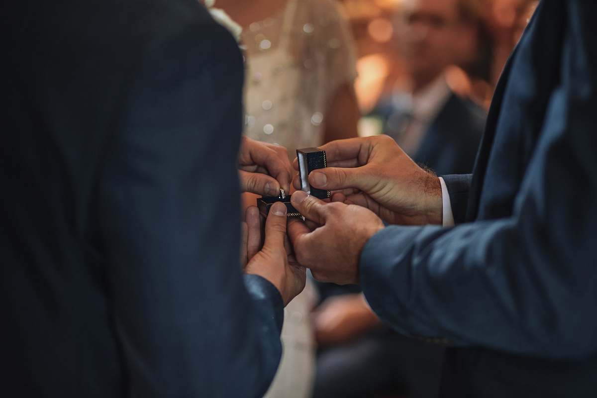 human man taking ring out of the box person