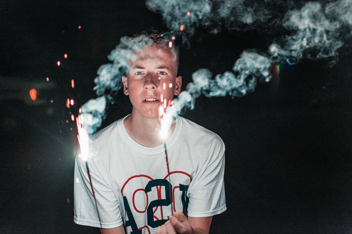 human person holding sparklers person