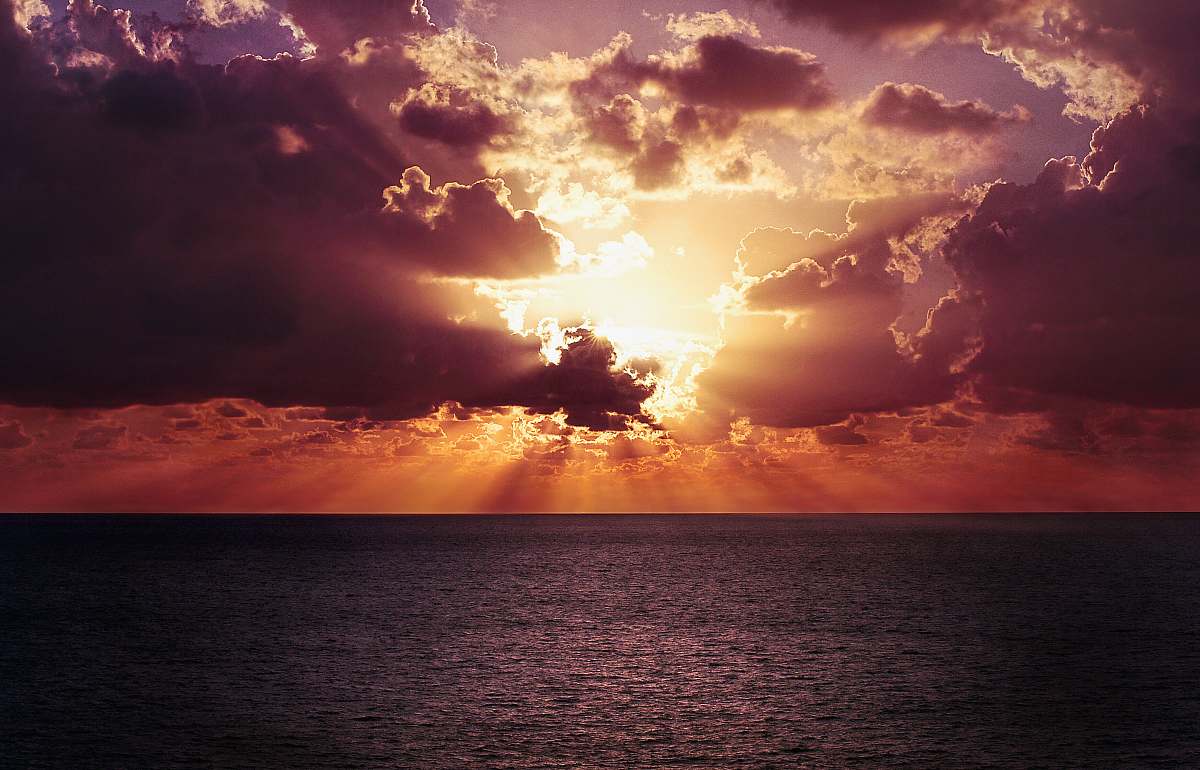 sky photo of a body of water and sunrise cloud