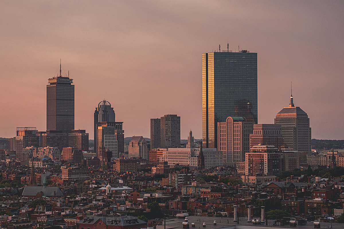 city aerial view of city under cloudy sky during daytime urban