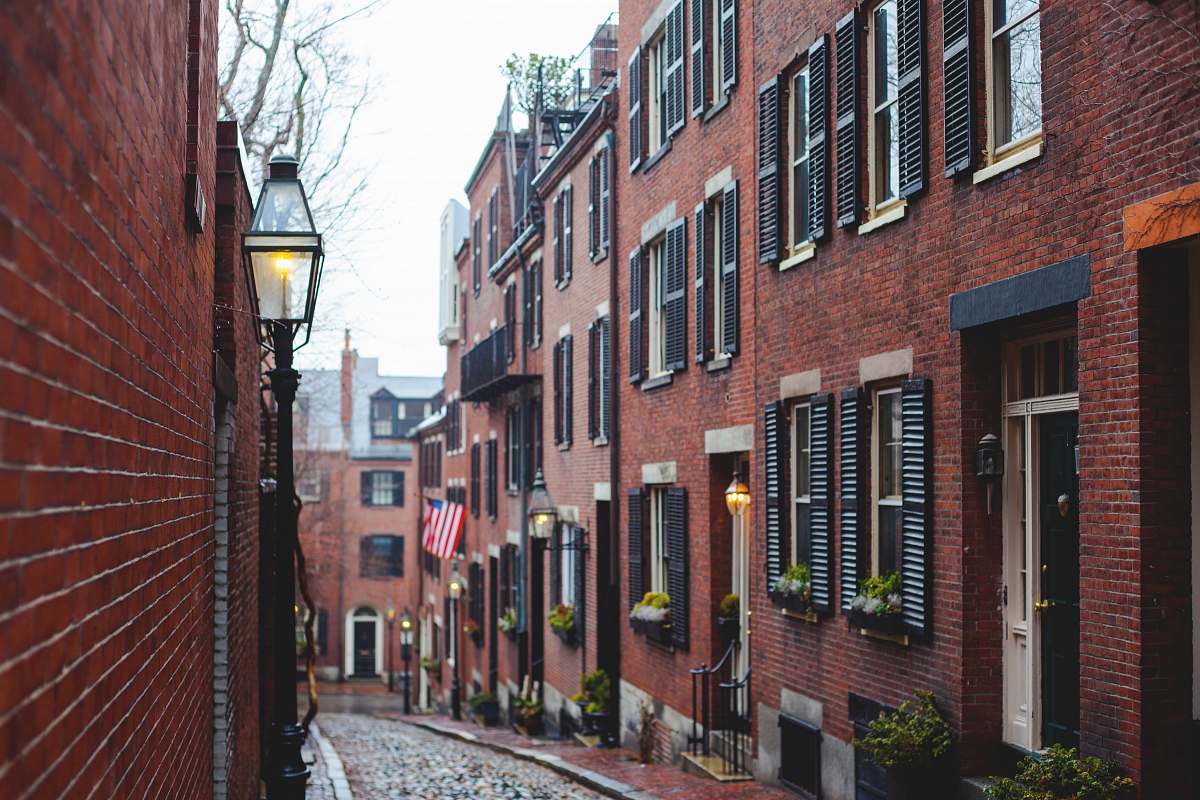 boston brown concrete building with patio light during daytime brick