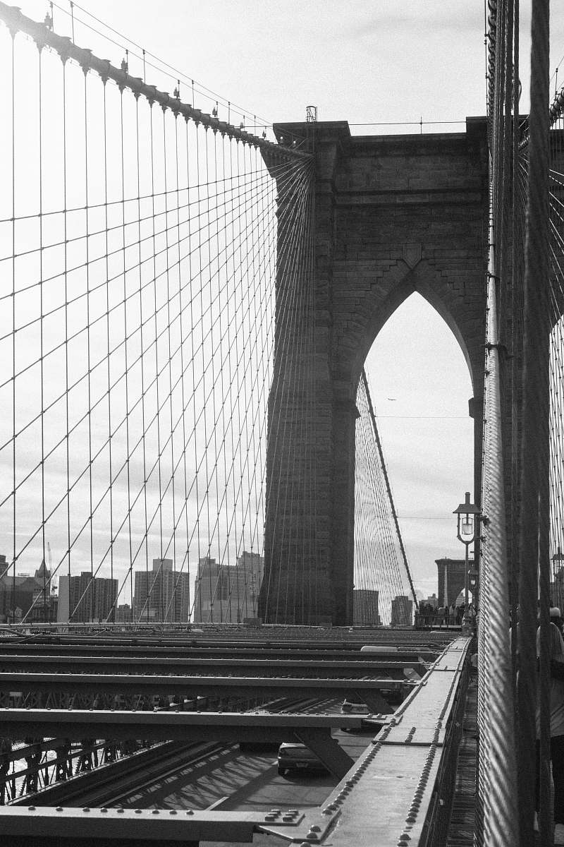 building grayscale photography of Brooklyn Bridge bridge