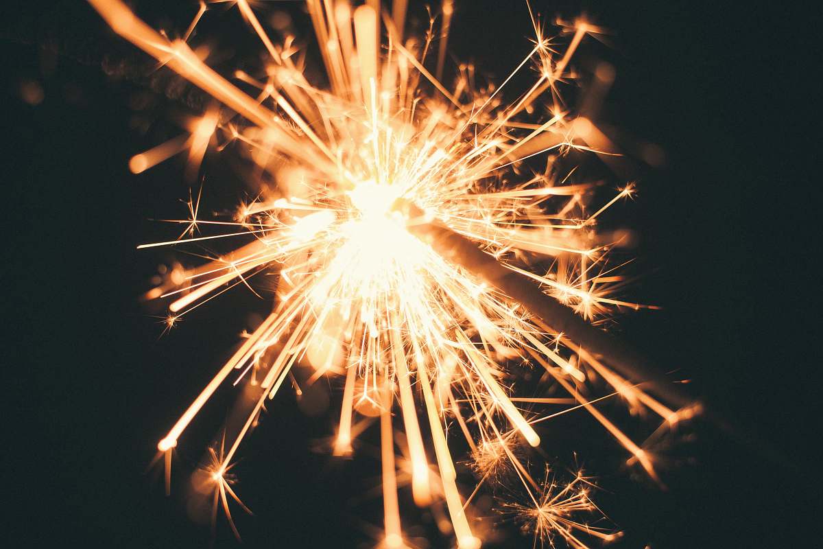 night photo of lighted sparkler outdoors
