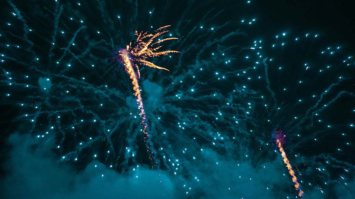 night timelapsed photo of a fireworks display outdoors