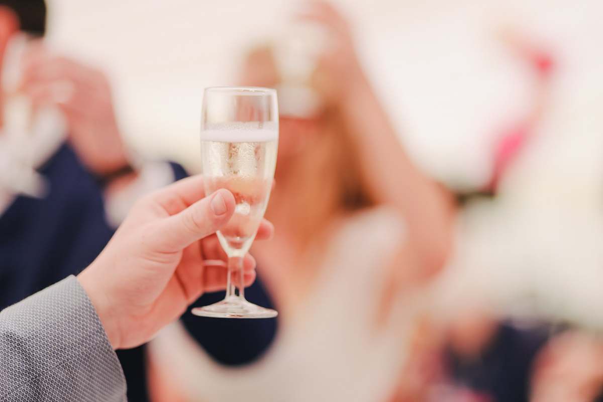 person person holding wine glass people