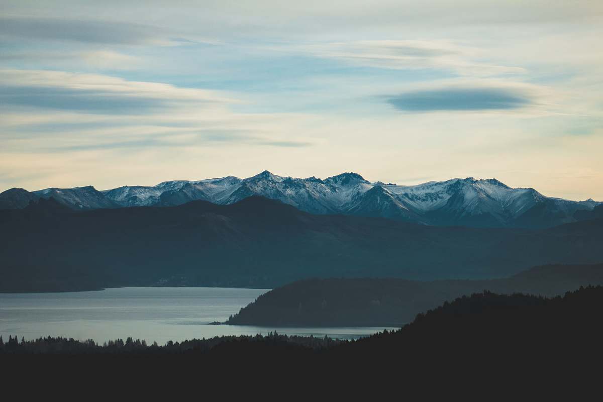 nature trees, lake, and mountains during day mountain range