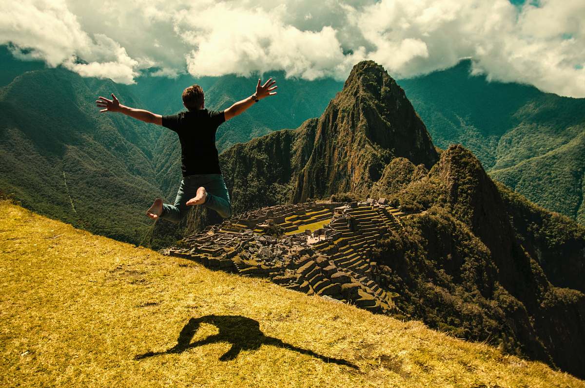 outdoors man jumping in green open field human