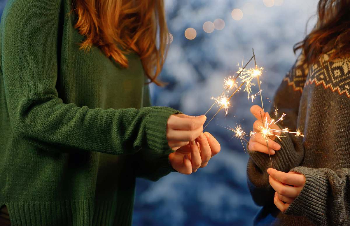 person two girls holding firecracker human