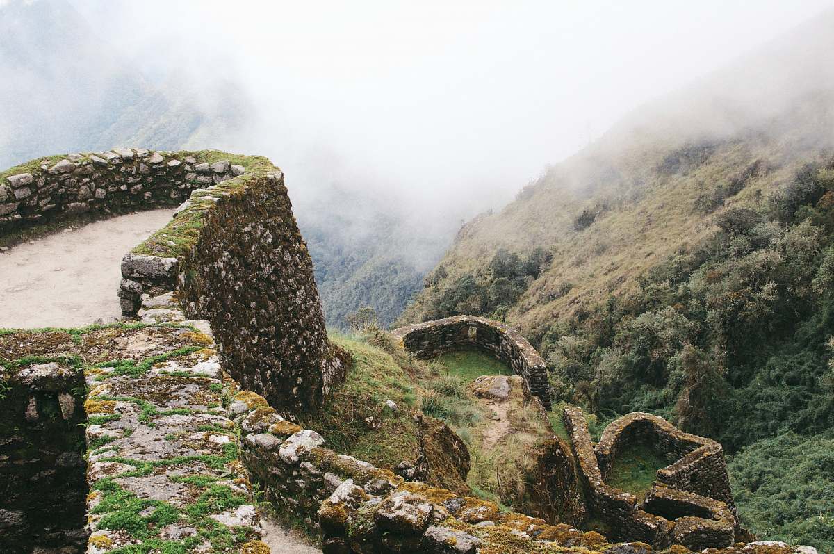 landscape green grass mountain with fog ancient