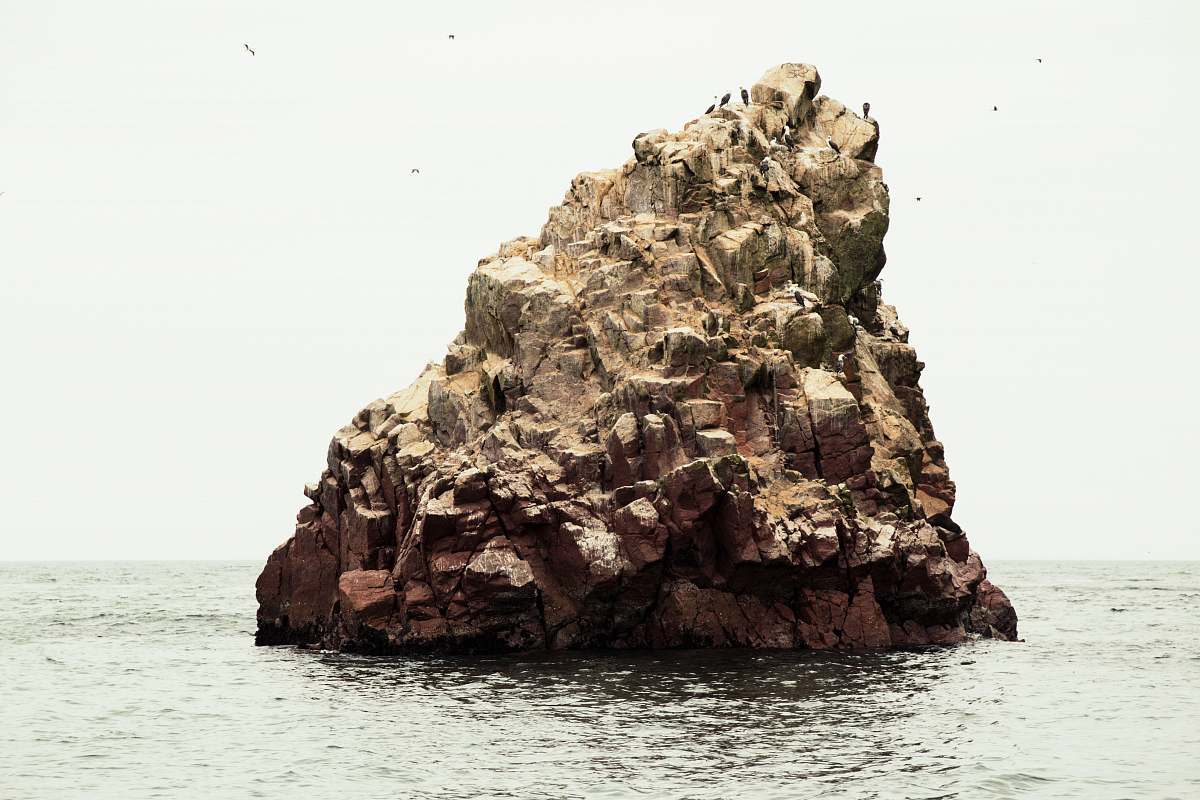ocean rocky formation near the body of water rock