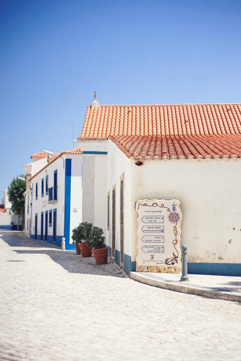 house photograph of white concrete houses street
