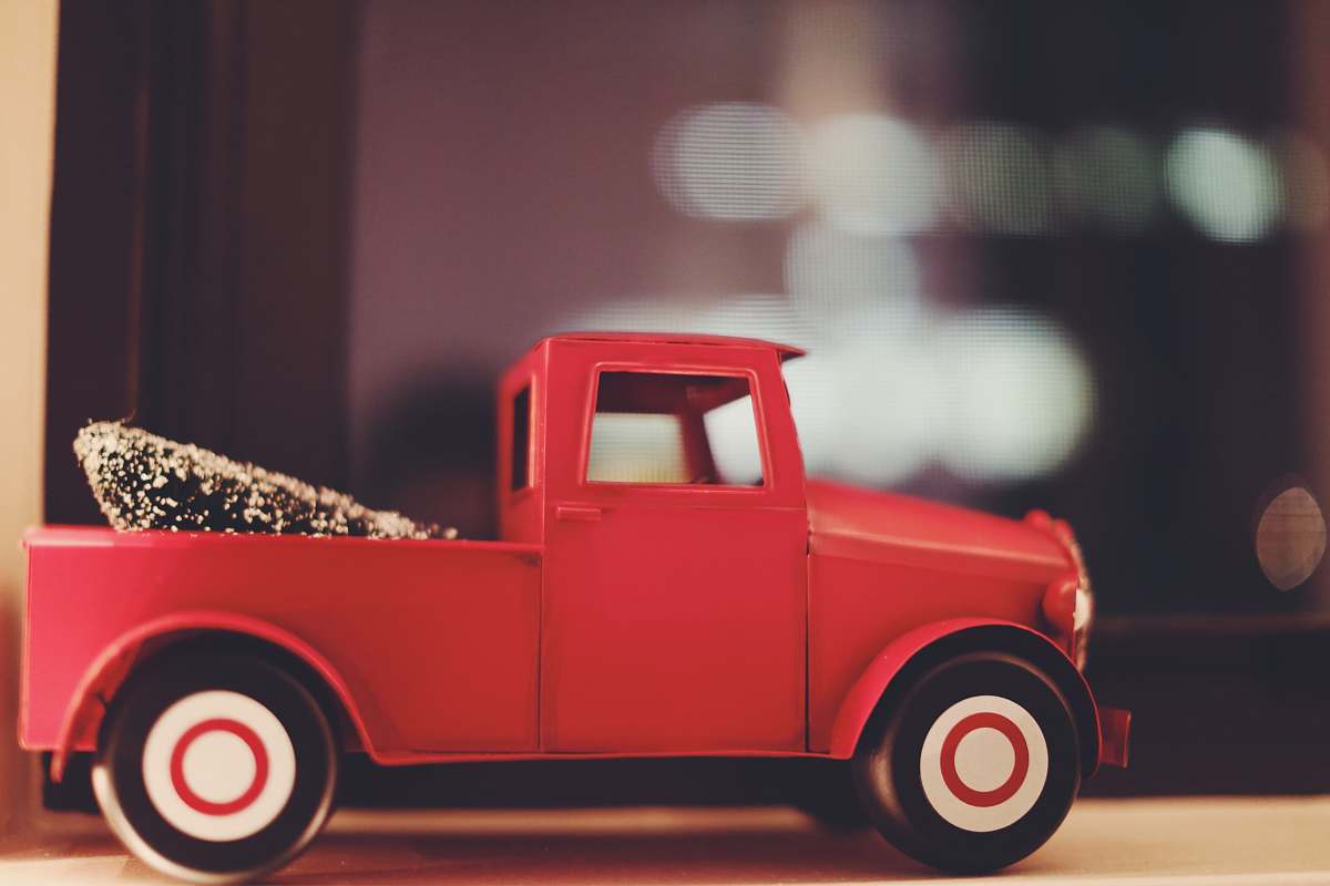 truck red toy car on white surface vehicle