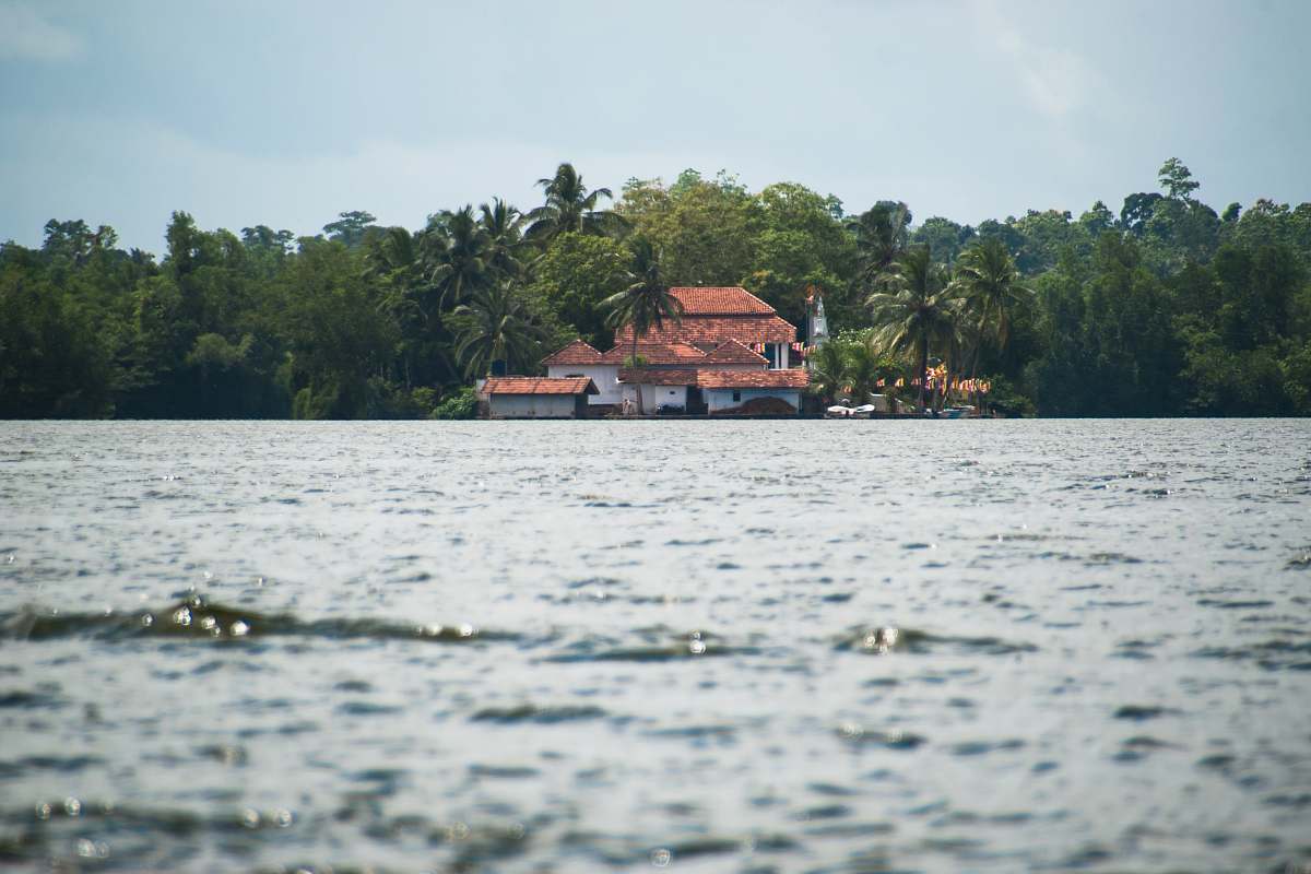 building white and brown house on island water