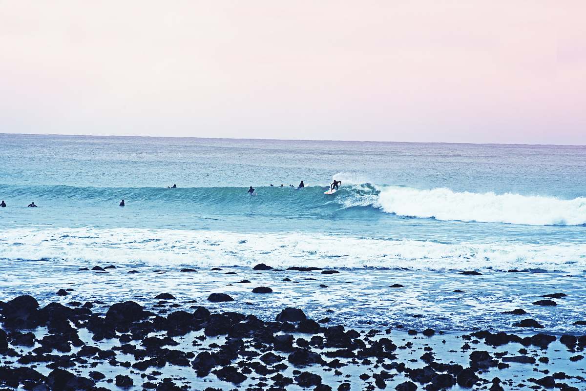 ocean people surfboarding during daytime new zealand